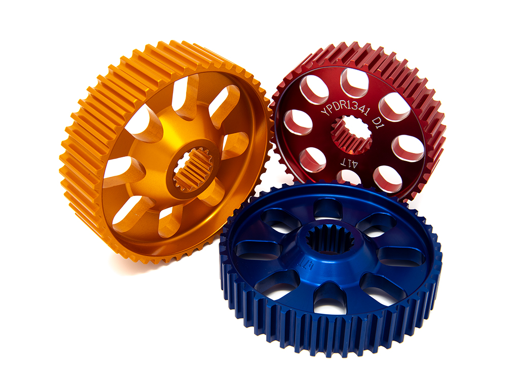 3 small gears in orange, red, and blue